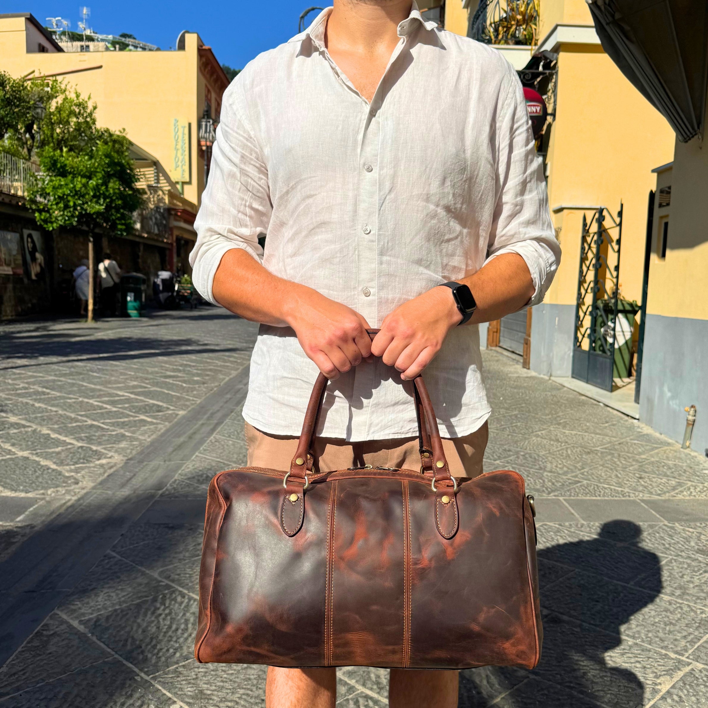 The Compact Distressed Buffalo Duffel with Optional Adjustable Shoulder Strap