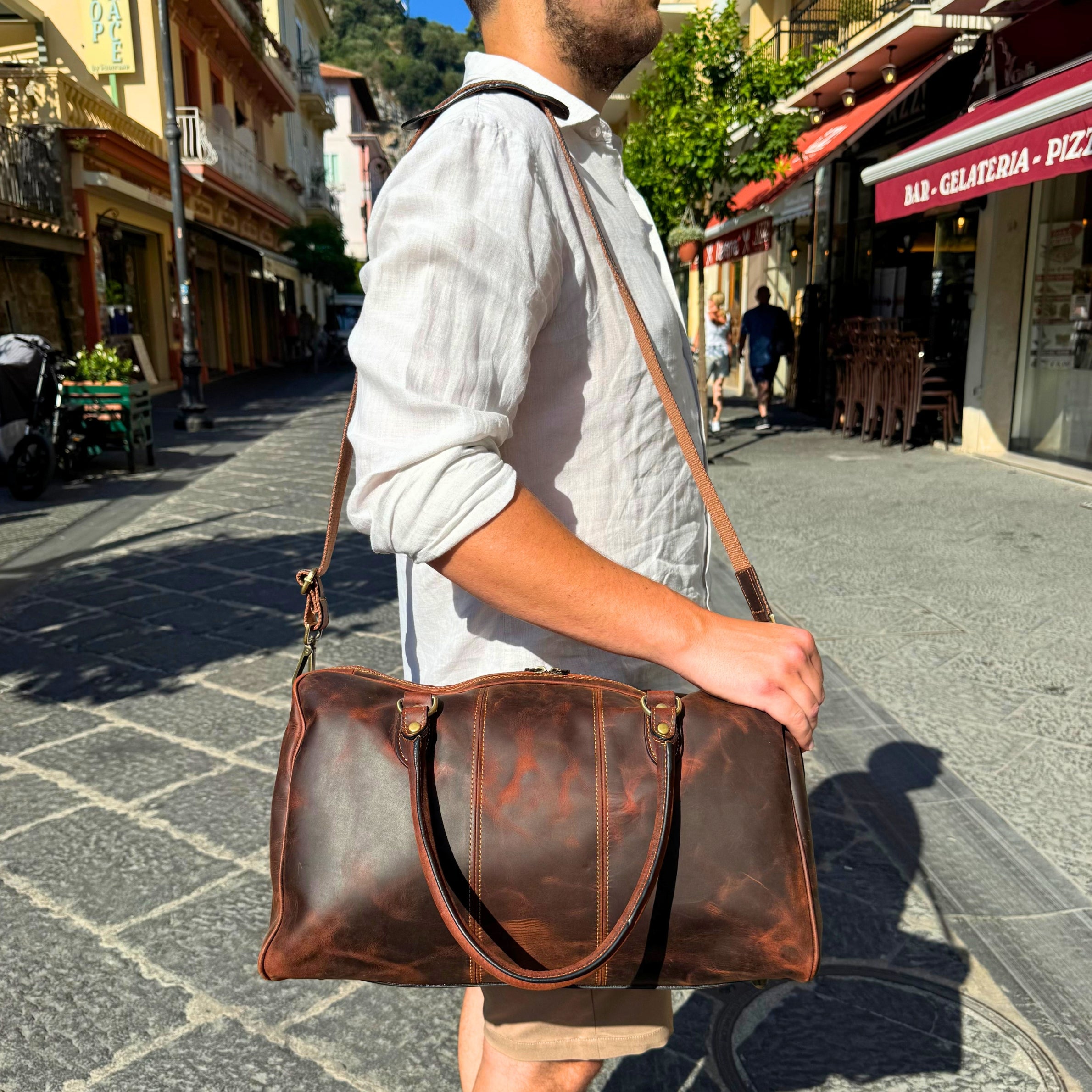 The Compact Distressed Buffalo Duffel with Optional Adjustable Shoulder Strap